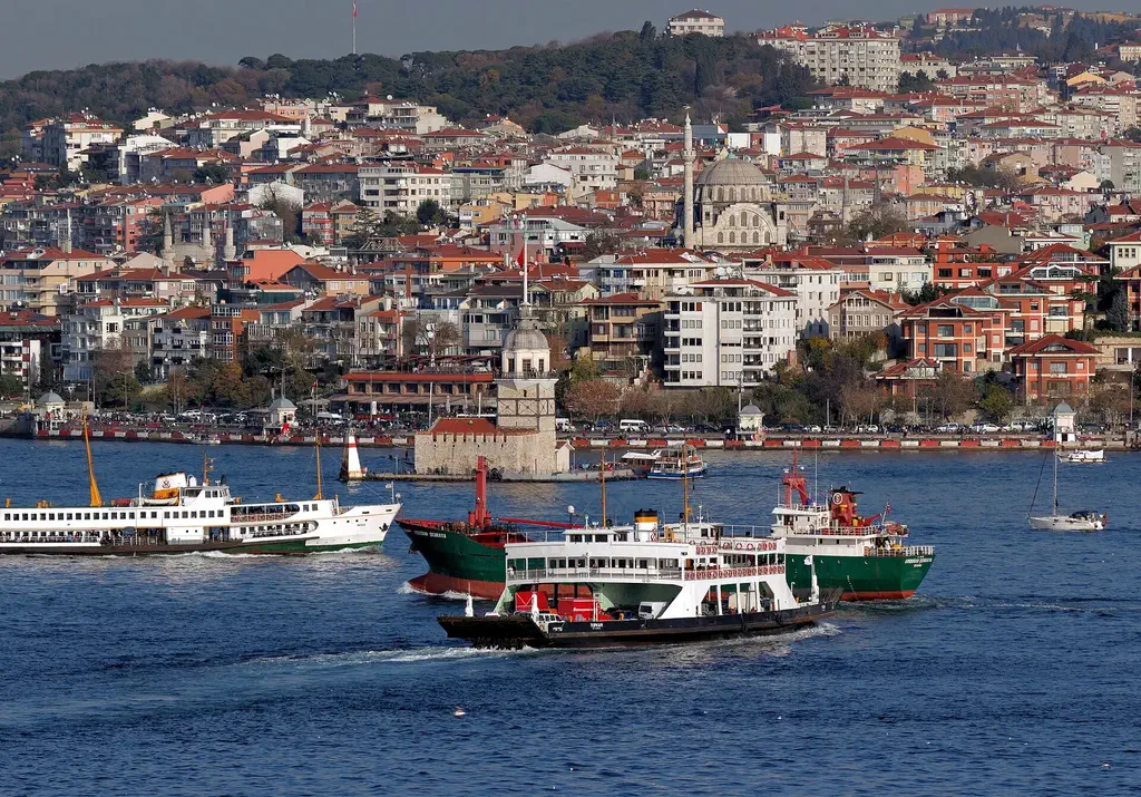 Sehir Hatlari public ferry cruising the Bosphorus past the European shore in Istanbul