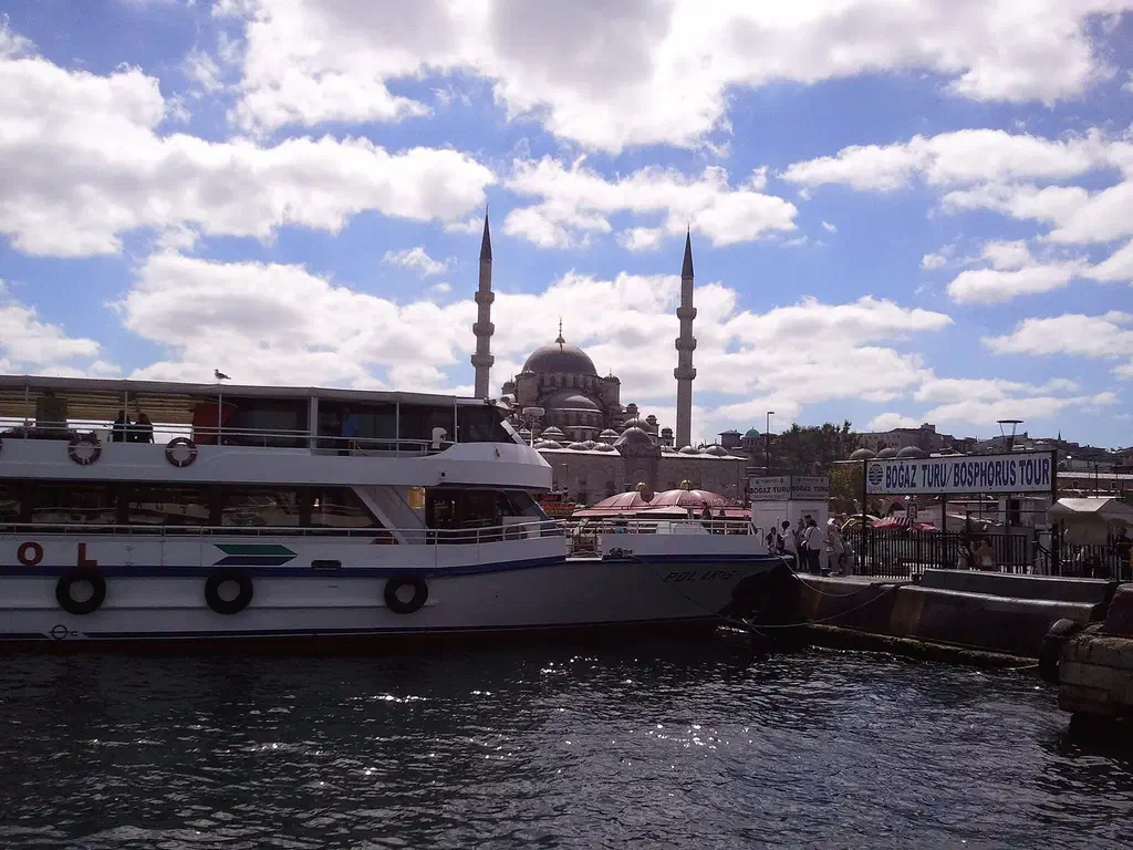 Bosphorus tour boats moored at Eminönü pier in Istanbul, where touts oversell short cruises