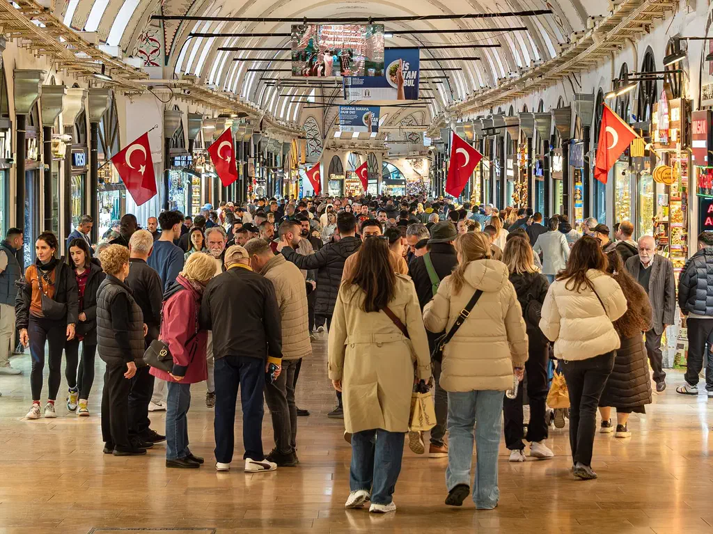 Shoppers and shopkeepers inside Istanbul's Grand Bazaar, where a few Turkish words ease the bargaining