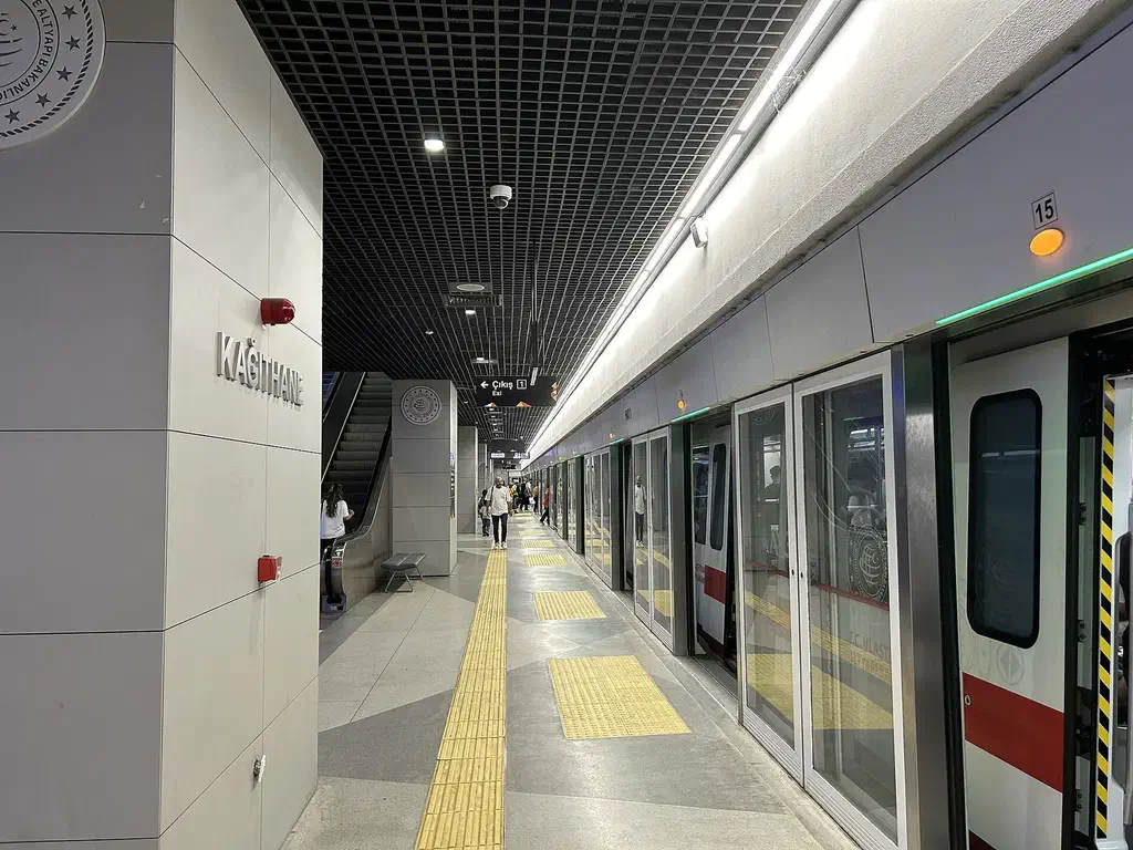 An M11 metro train at the underground Istanbul Airport station platform