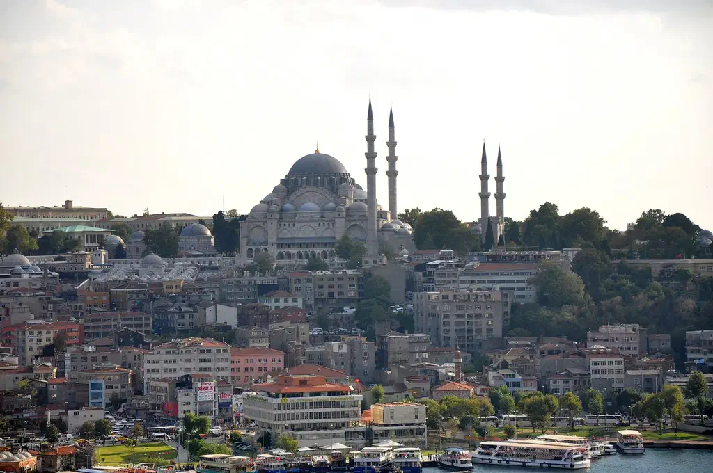 The historic Istanbul skyline crowned by the Süleymaniye Mosque, seen from a terrace