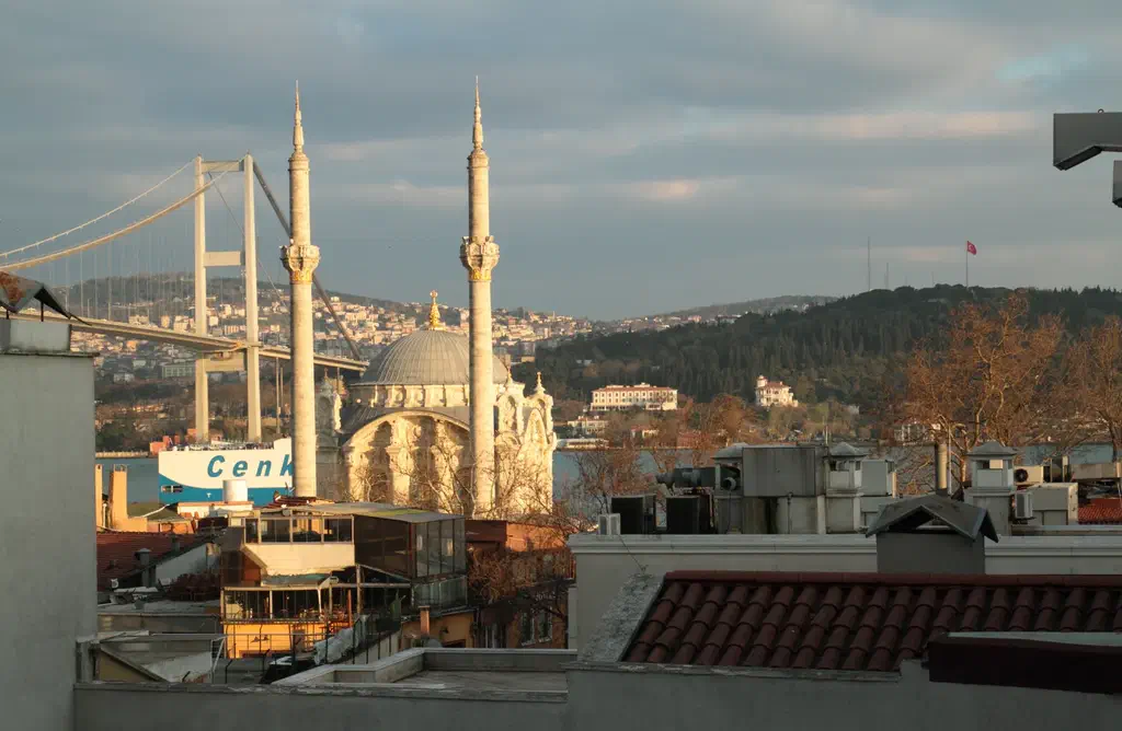 Ortakoy Mosque seen from the water with the Bosphorus Bridge behind it on the European shore
