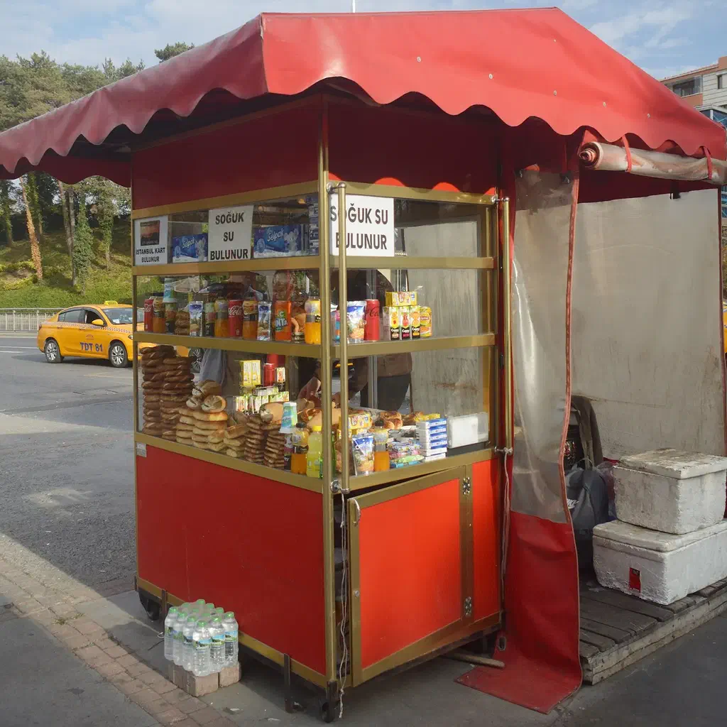 A red simit cart in Istanbul piled with sesame rings, an easy first order in Turkish