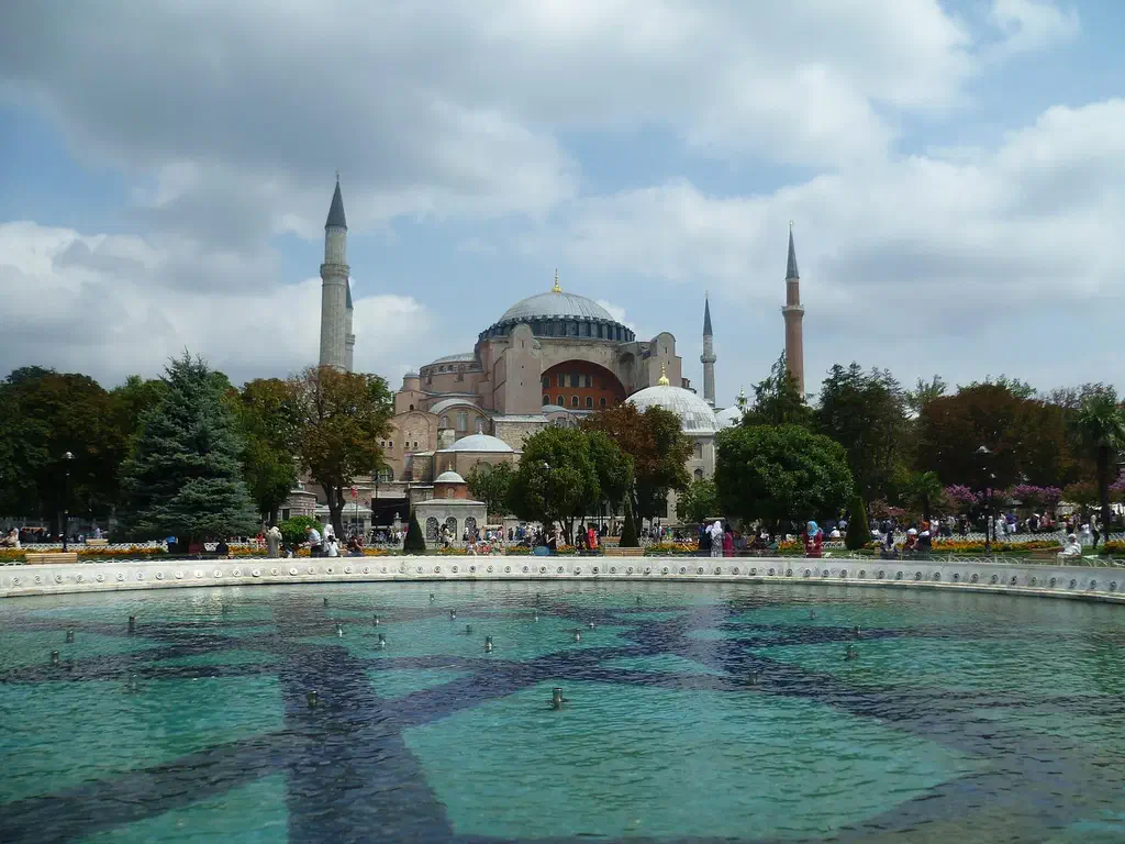 Sultanahmet square in Istanbul with Hagia Sophia rising behind the gardens and fountains