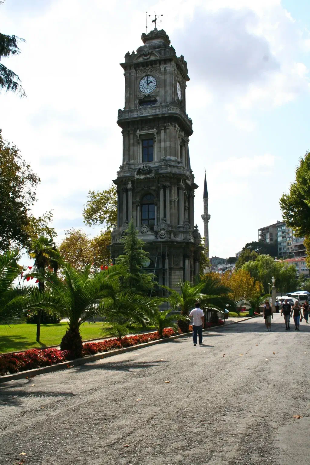 Dolmabahce Palace’s clock tower beside the Bosphorus with the palace gardens behind