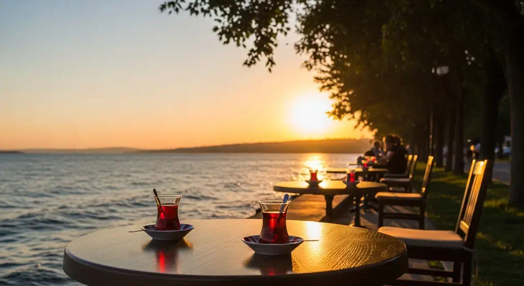 Cafe tables in the evening light in Kadikoy’s Moda neighbourhood with the Sea of Marmara behind